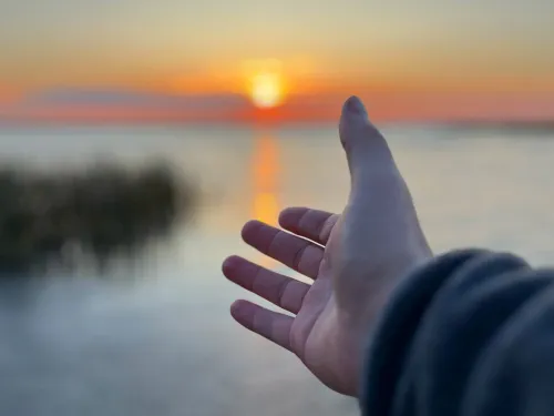 Gull Lake Alberta reaching hand Jeremy Derksen ZenSeekers