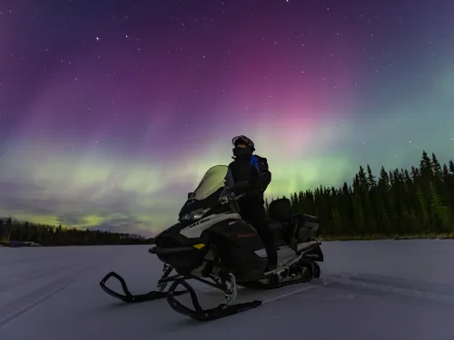 Northern lights aurora photography snowmobile Paul Lavoie