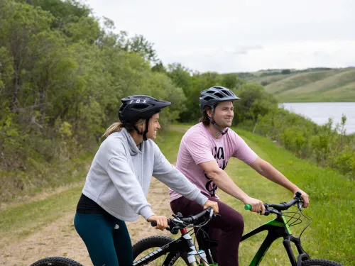 Riding bikes along the lake at Vermilion Provincial Park