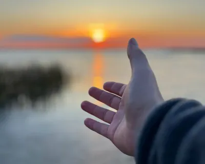 Gull Lake Alberta reaching hand Jeremy Derksen ZenSeekers