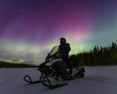 Northern lights aurora photography snowmobile Paul Lavoie