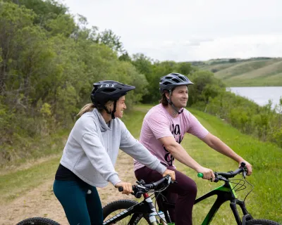 Riding bikes along the lake at Vermilion Provincial Park