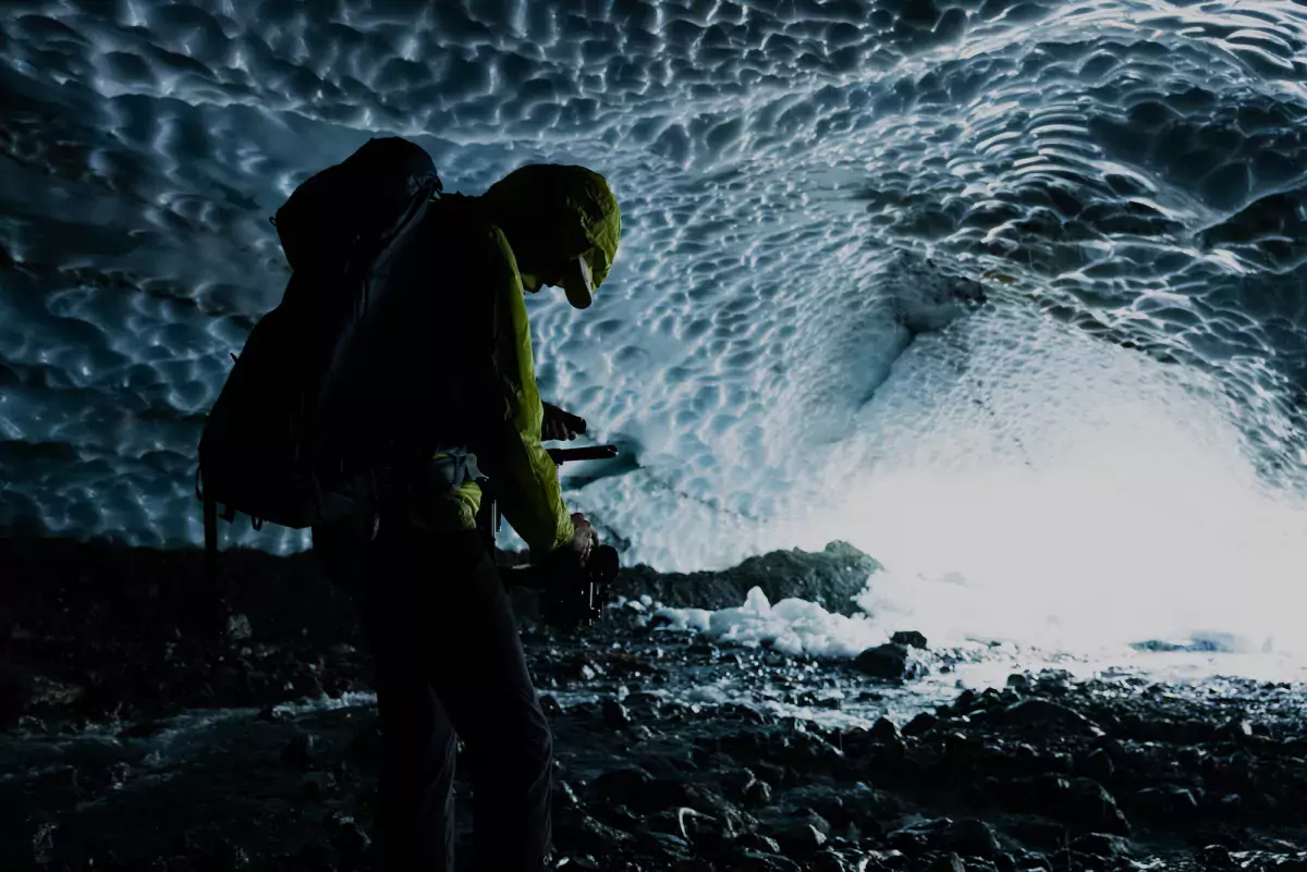 Jaiden George films inside a cave in the Comox Glacier, for his film Finding Solitude.