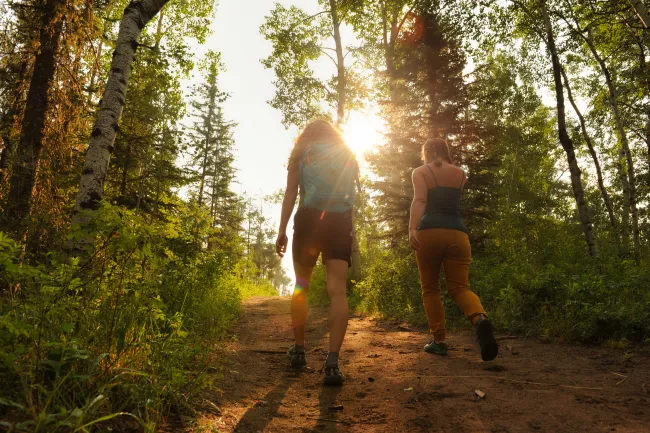 Women hiking in the forest near Grande Prairie