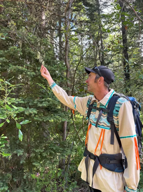 Jordan Ede of Mahikan Trails leads a medicine walk along the Village Rim Trail in Kananaskis